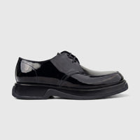 Men's black patent leather chunky sole lace-up formal shoe, viewed from the side on a white background.
