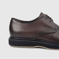 Close-up side view of Formales Men's Leather Chunky Sole Lace Up shoe in dark coffee brown with black sole.