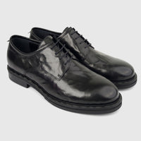 Formales Men's black leather lace-up shoes with chunky soles, featuring a sleek design and shiny finish, presented in an