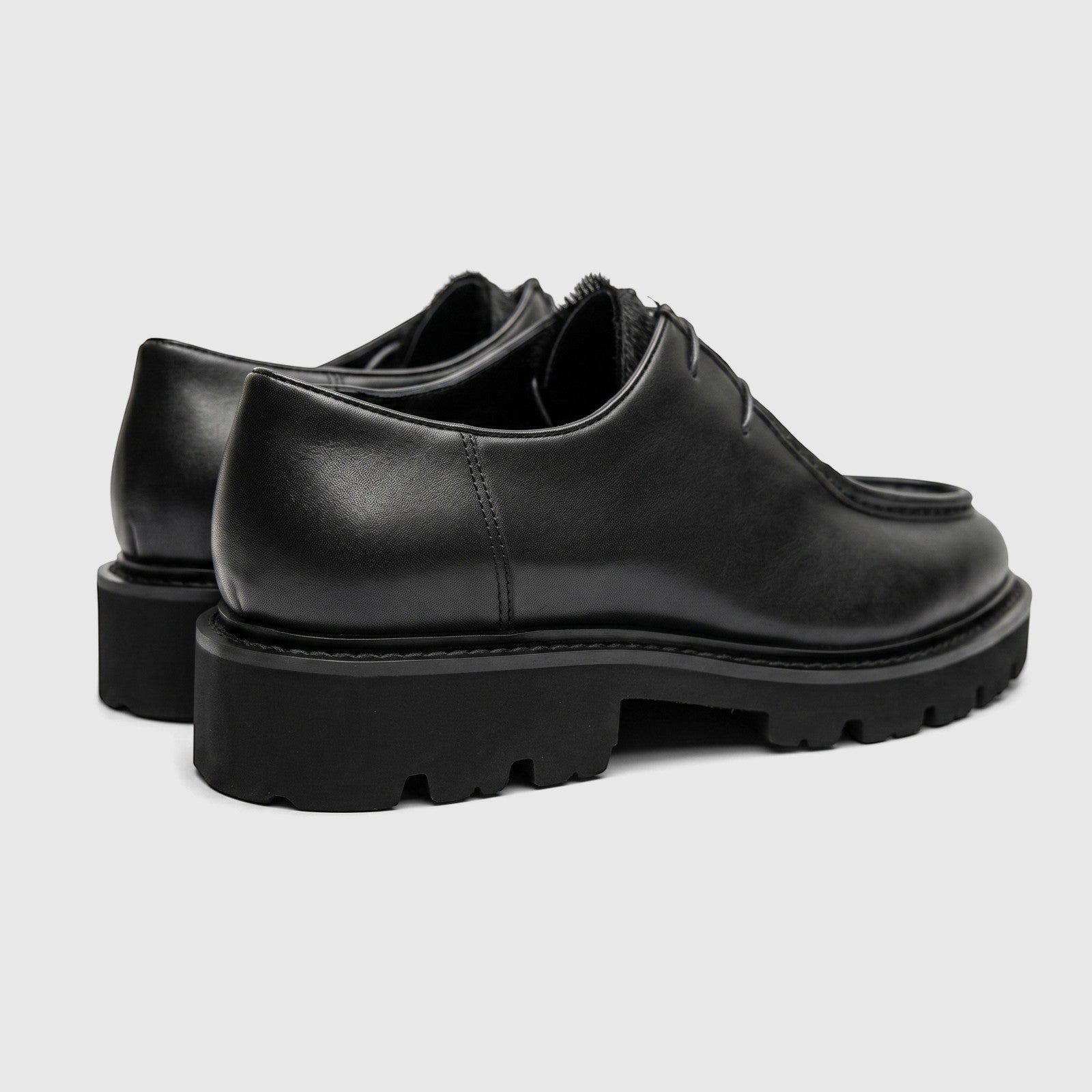 Formales Men's black leather chunky sole lace-up shoes, shown from a rear-side view highlighting the lugged sole.