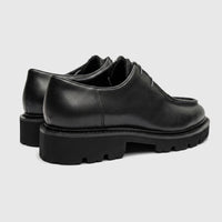 Formales Men's black leather chunky sole lace-up shoes, shown from a rear-side view highlighting the lugged sole.