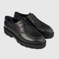 A pair of black Formales Men's Leather Chunky Sole Lace Up shoes, featuring a textured fur vamp and thick rubber soles,
