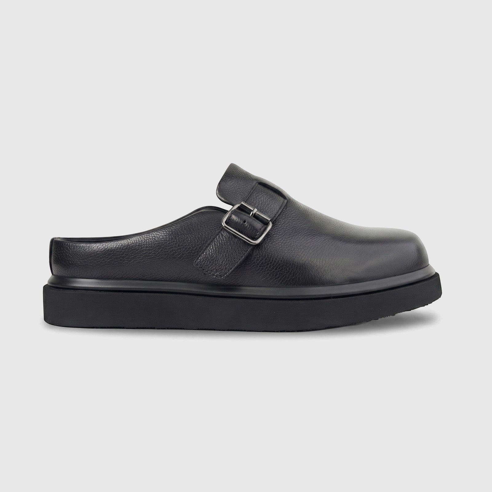 Formales Men's Leather Chunky Sole Mule in black, with a grained leather upper and a silver buckle, shown in a side profile.