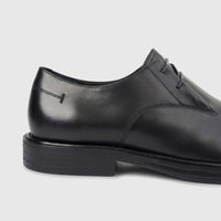 Close-up of a black Formales Men's Leather Chunky Sole Slip On shoe, showcasing the elegant leather, intricate stitching,