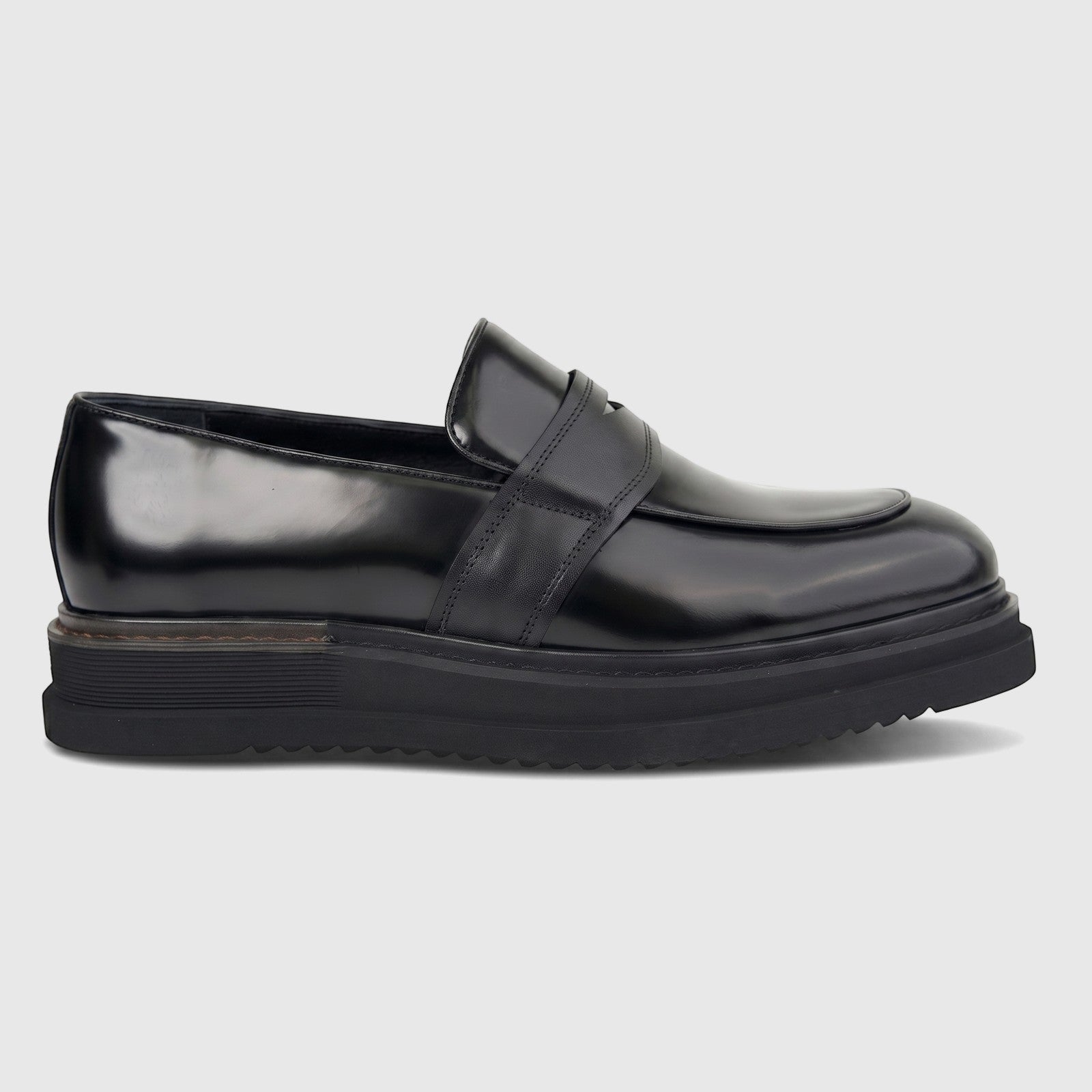 Black men's Formales chunky sole slip-on loafer shoe, crafted from patent leather, presented in a side view.