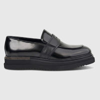 Black men's Formales chunky sole slip-on loafer shoe, crafted from patent leather, presented in a side view.