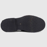 Formale's men's black leather slip-on shoe with a chunky, textured sole, viewed from the underside.
