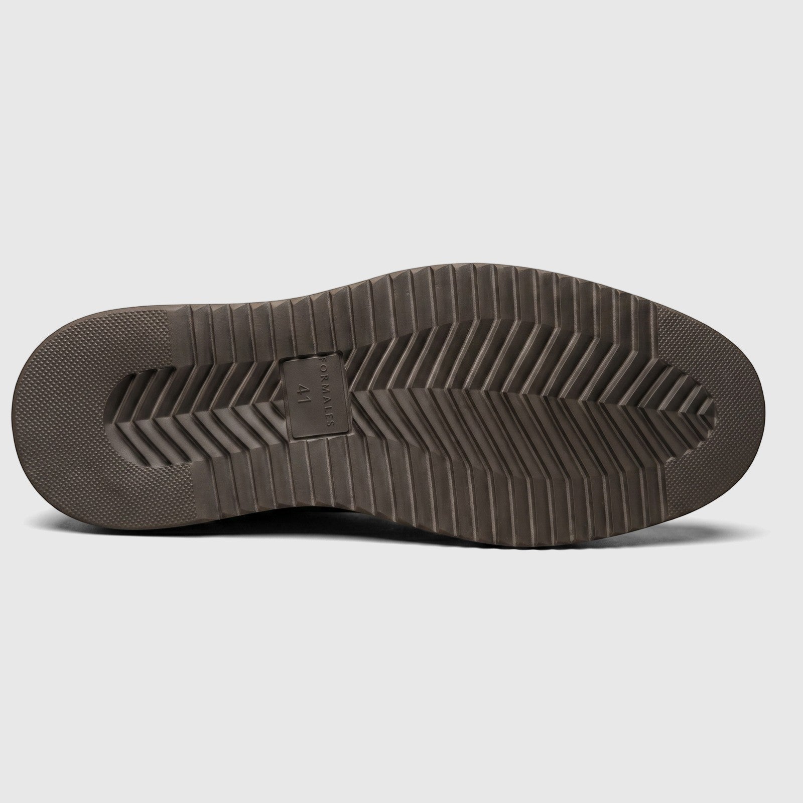 Bottom view of a Formales men's coffee brown leather slip-on shoe, showcasing the chunky sole with its detailed tread