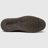 Bottom view of a Formales men's coffee brown leather slip-on shoe, showcasing the chunky sole with its detailed tread