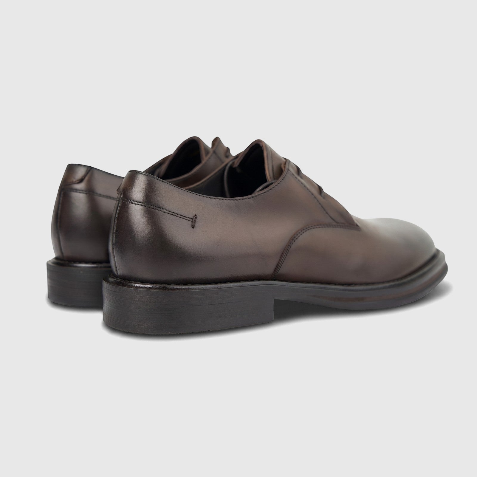 Formales Men's leather chunky sole slip-on shoes in coffee brown, showcasing the rear-right side with polished leather and