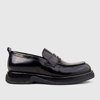 Black high-shine formal men's slip-on loafer with a chunky sole, presented in a side profile view.