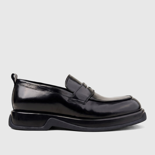 Black high-shine formal men's slip-on loafer with a chunky sole, presented in a side profile view.