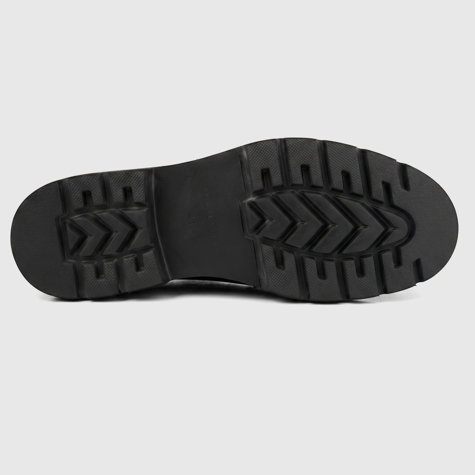 Black chunky sole of a Formales men's leather boot, featuring a durable, textured tread and visible brand name.