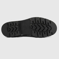 Black chunky sole of a Formales men's leather boot, featuring a durable, textured tread and visible brand name.