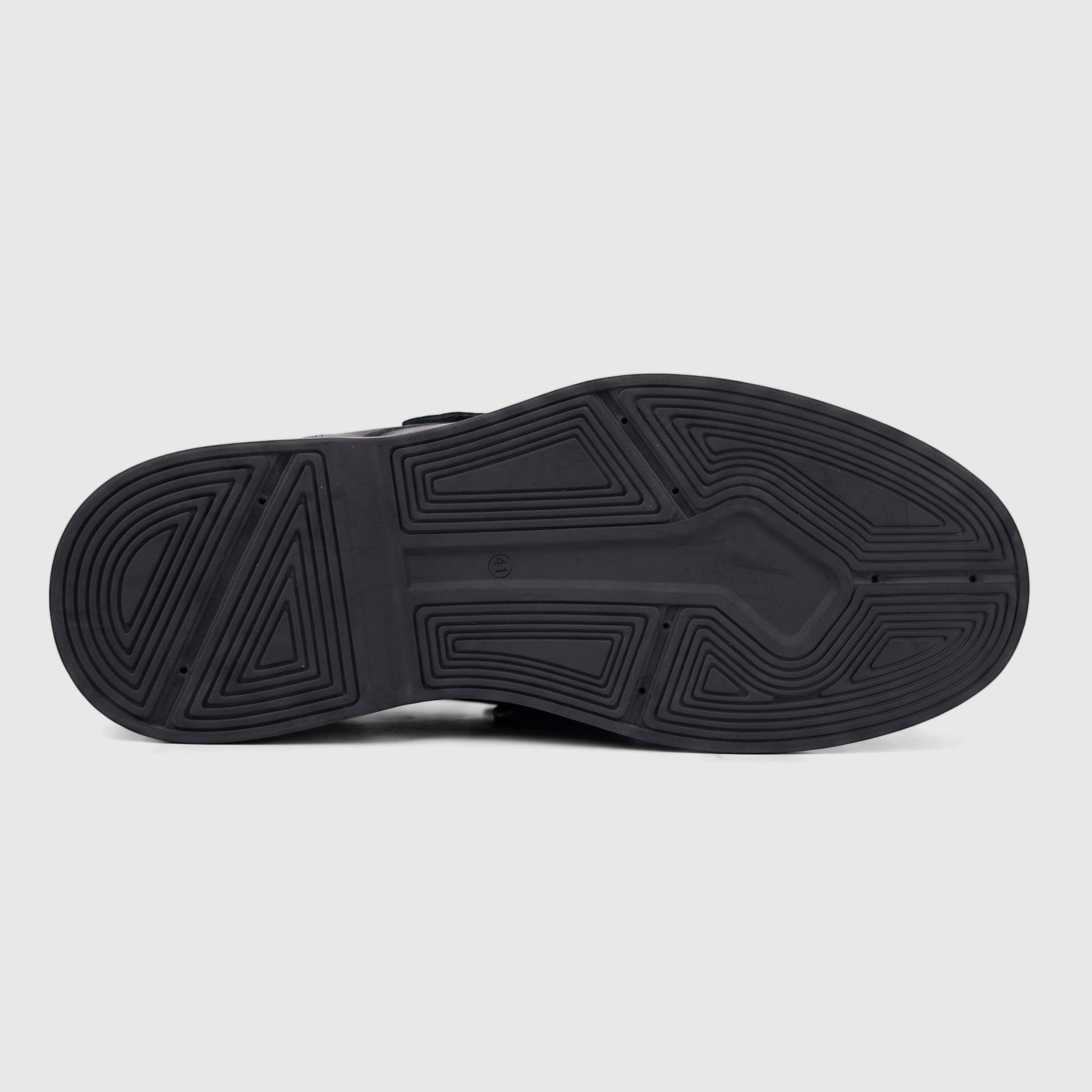 Bottom view of a black chunky sole from a Formales men's leather lace-up shoe, showcasing its detailed geometric tread