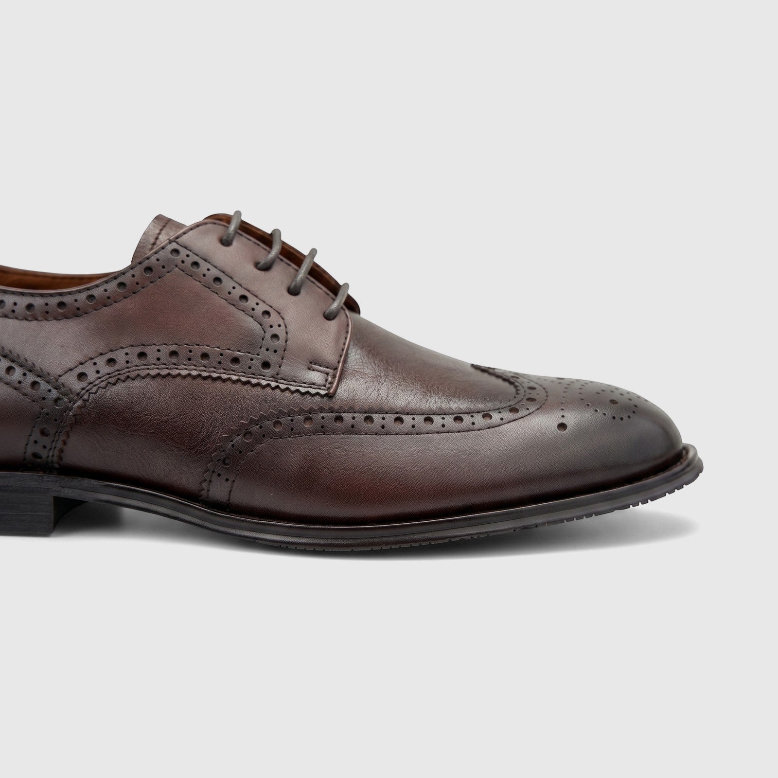 Side view of a Formales Men's Leather Dress Lace Up FD265003 Coffee FD32 shoe, featuring intricate brogue detailing.