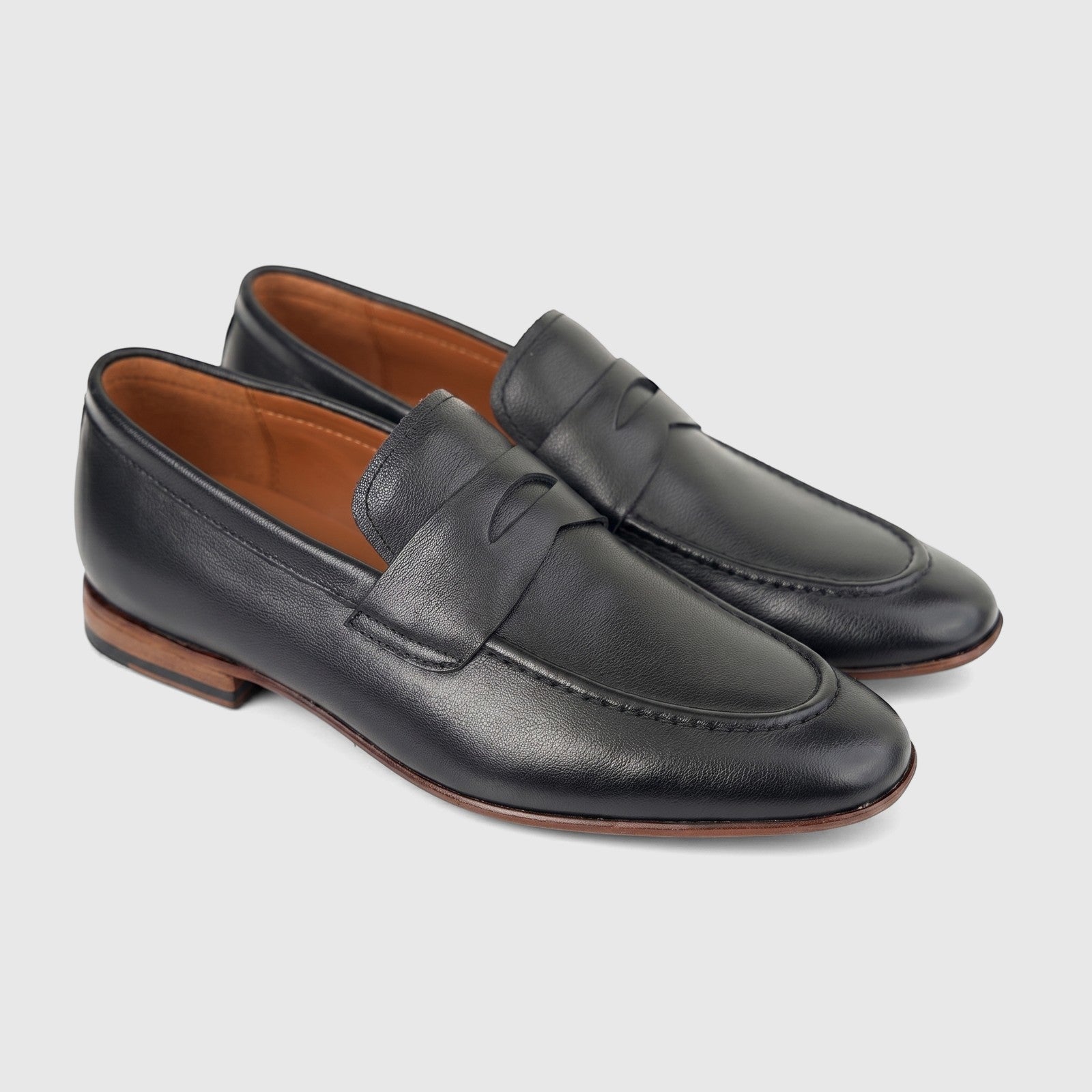 Formales Men's Leather Dress Slip On FD265002 Black, a pair of grained black leather penny loafers with brown soles.