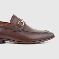 Formales Men's Leather Dress Slip On shoe in coffee brown, featuring a pebbled texture and distinctive gold horsebit detail.