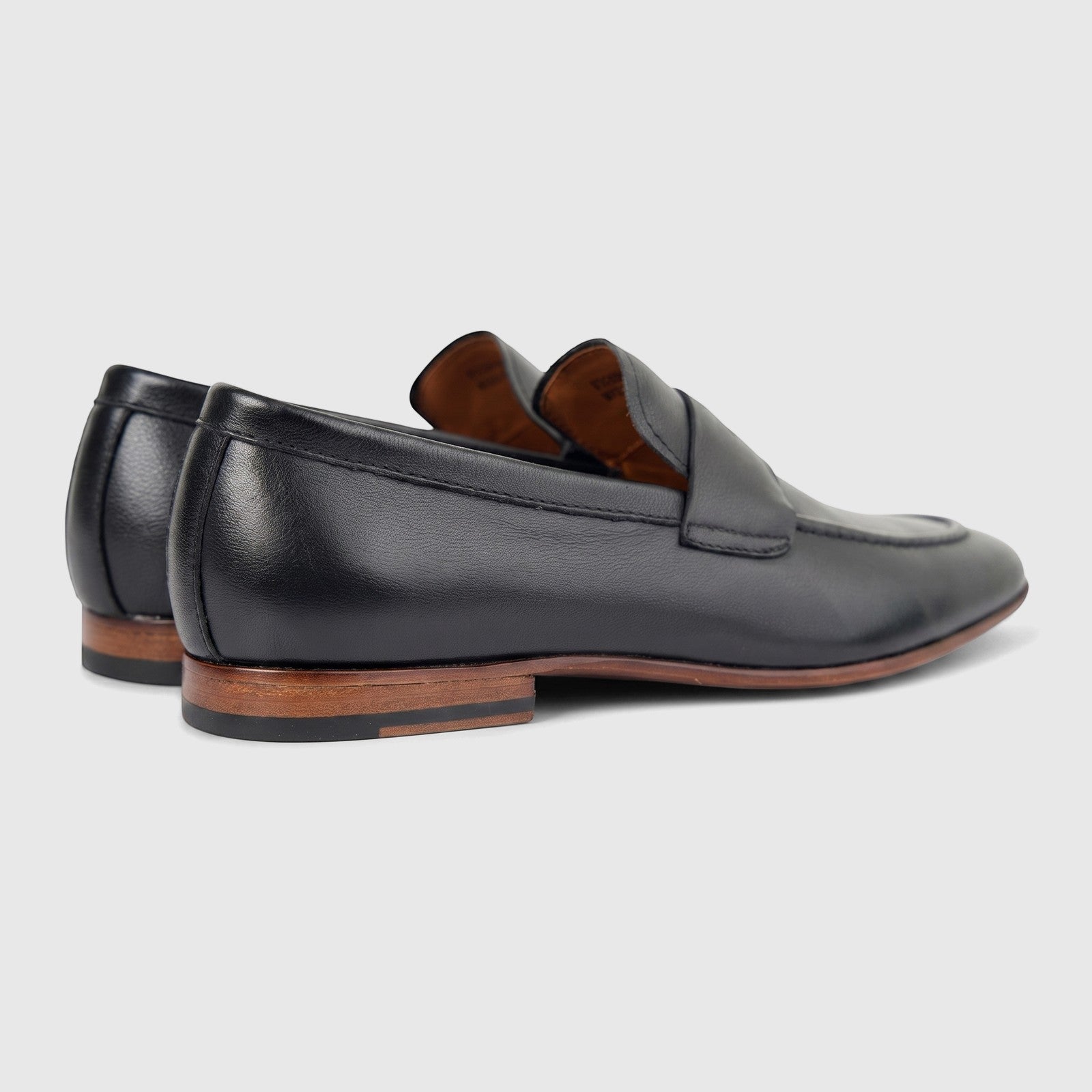 Black leather Formales Men's Dress Slip-On Loafers (FD265002) with visible stitching and brown layered heels, shown from a