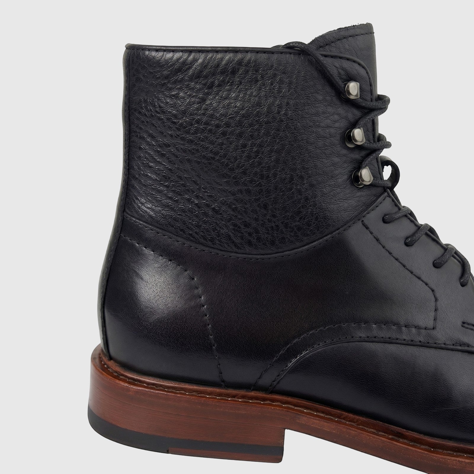Close-up side view of a Formales Men's Leather Lace Up Boot FD265008 in black with a brown sole.