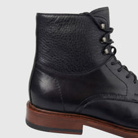 Close-up side view of a Formales Men's Leather Lace Up Boot FD265008 in black with a brown sole.