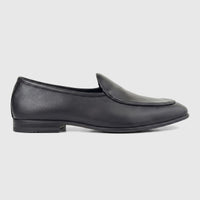 A single black leather men's loafer, seen from the side, with a low heel and clean stitching.