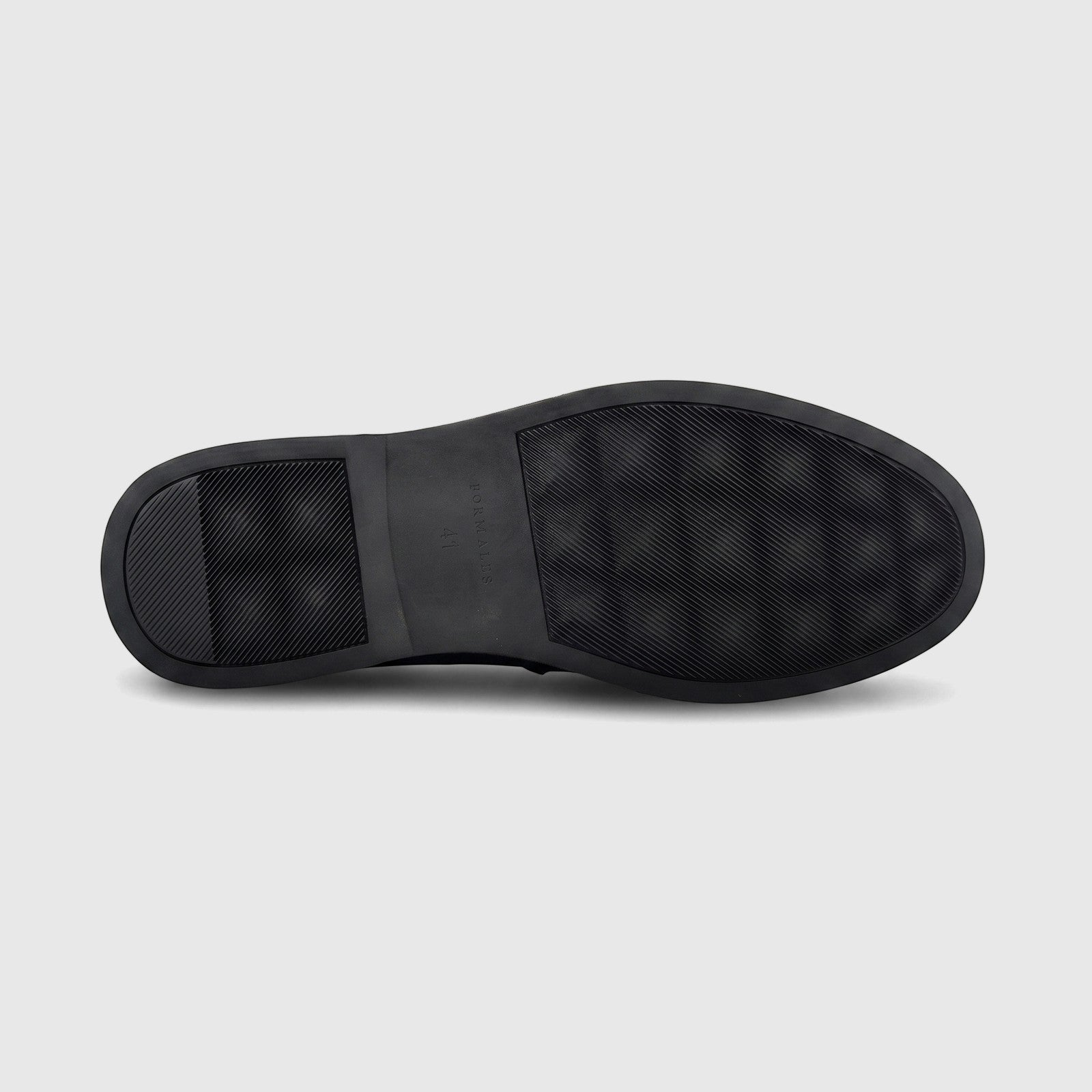 Black rubber sole of a Formales men's loafer, featuring a textured anti-slip pattern and embossed branding.