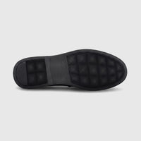 Black rubber sole of a Formales men's loafer, featuring a textured anti-slip pattern and embossed branding.