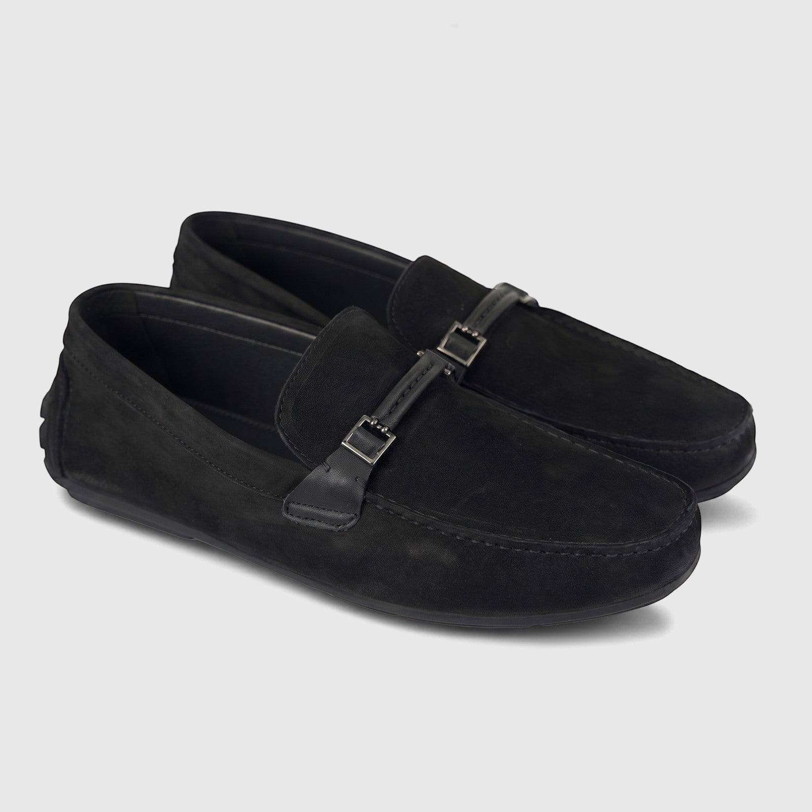 Pair of black suede Formales Men's Leather Loafer shoes with silver buckle details, viewed from a slight angle.