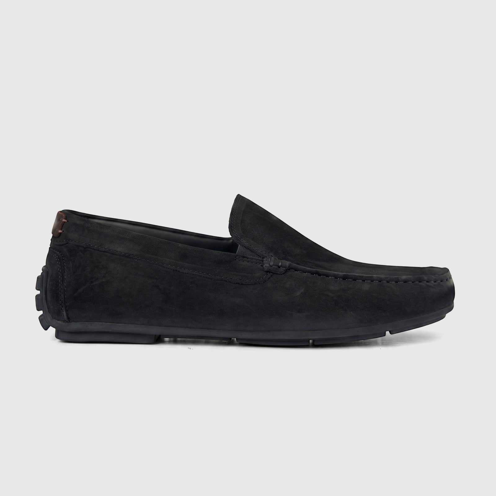 Side view of Formales Men's Leather Loafer FT268019 Black FK74. Black suede-like moccasin with a subtle brown heel accent.