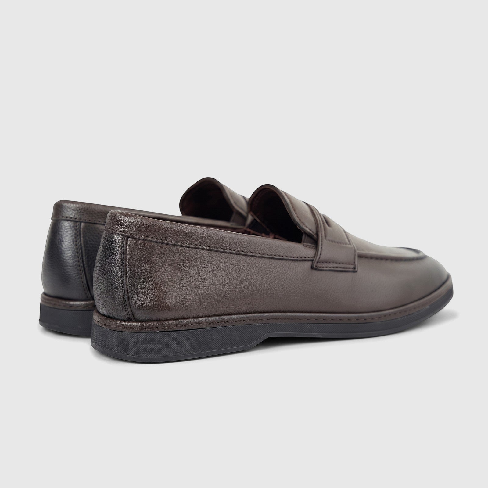 A pair of men's Formale leather loafers in coffee brown, featuring a classic design and a rich, tumbled texture, viewed from