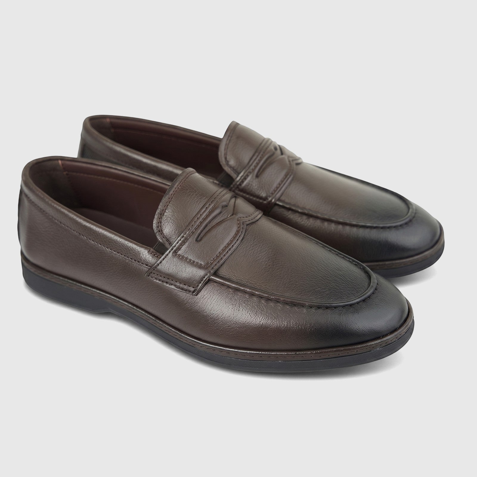 A pair of dark brown leather formal men's loafers, featuring a moc-toe design and a decorative strap across the vamp.