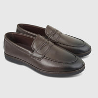 A pair of dark brown leather formal men's loafers, featuring a moc-toe design and a decorative strap across the vamp.