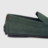 Dark green Formales Men's Leather Loafer, close-up showcasing suede texture, stitching, brown heel accent, and black sole.
