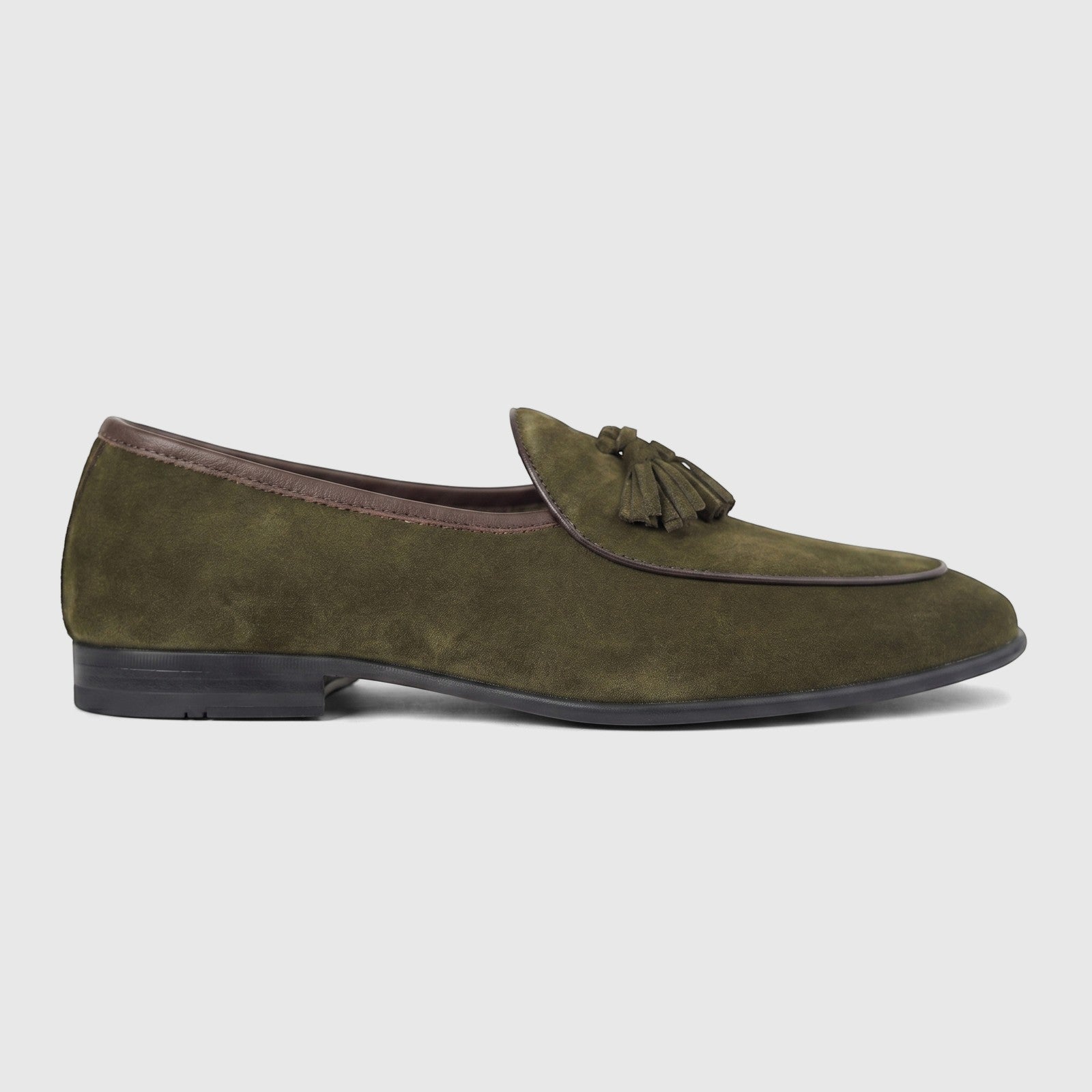 Formales Men's green suede loafer with decorative tassels, dark brown trim, and a black sole, viewed from the side.