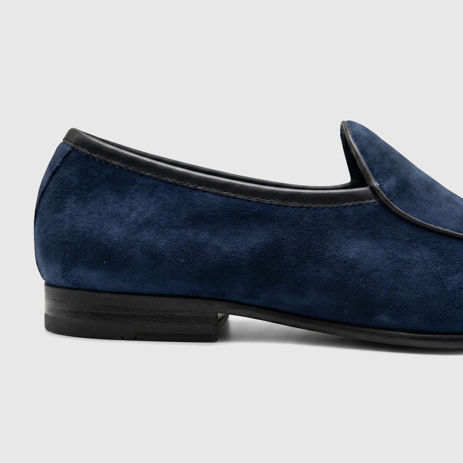 Side view of a single Formales Men's Leather Loafer FT268004 in navy blue suede with black piping and sole.