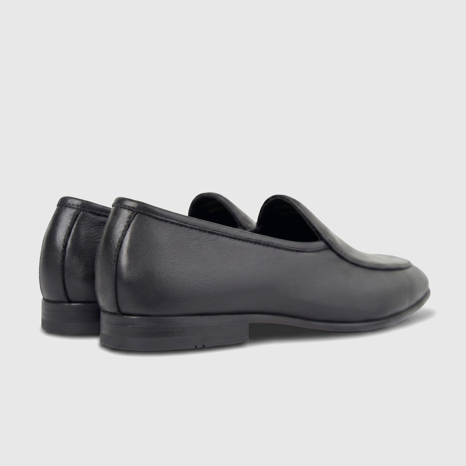 Two black Formales Men's Leather Loafer FT268005 shoes, shown from a rear-side view, highlighting smooth leather and classic