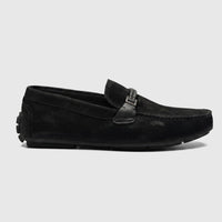 Formales Men's black leather loafer, side view. This sleek slip-on shoe features intricate stitching and a silver buckle