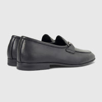 Pair of Formales Men's black leather loafers with a silver-tone bit detail, shown from a side-rear view.