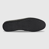 Bottom view of a Formales men's black leather slip-on shoe, showcasing the textured sole for enhanced grip and durability.