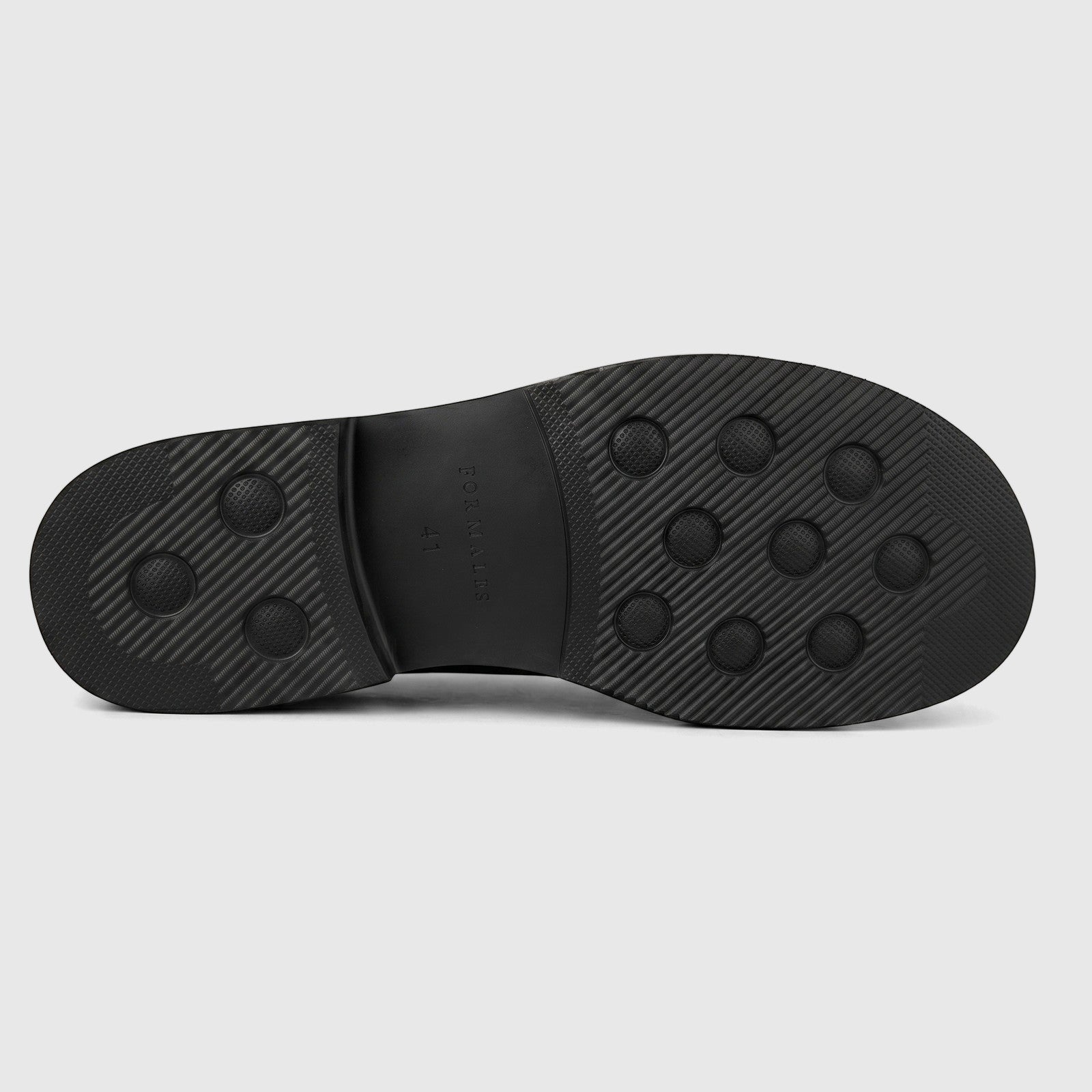 Black rubber sole of a Formales Men's Leather Slip On shoe, showcasing its textured grip pattern, brand name, and size 41.