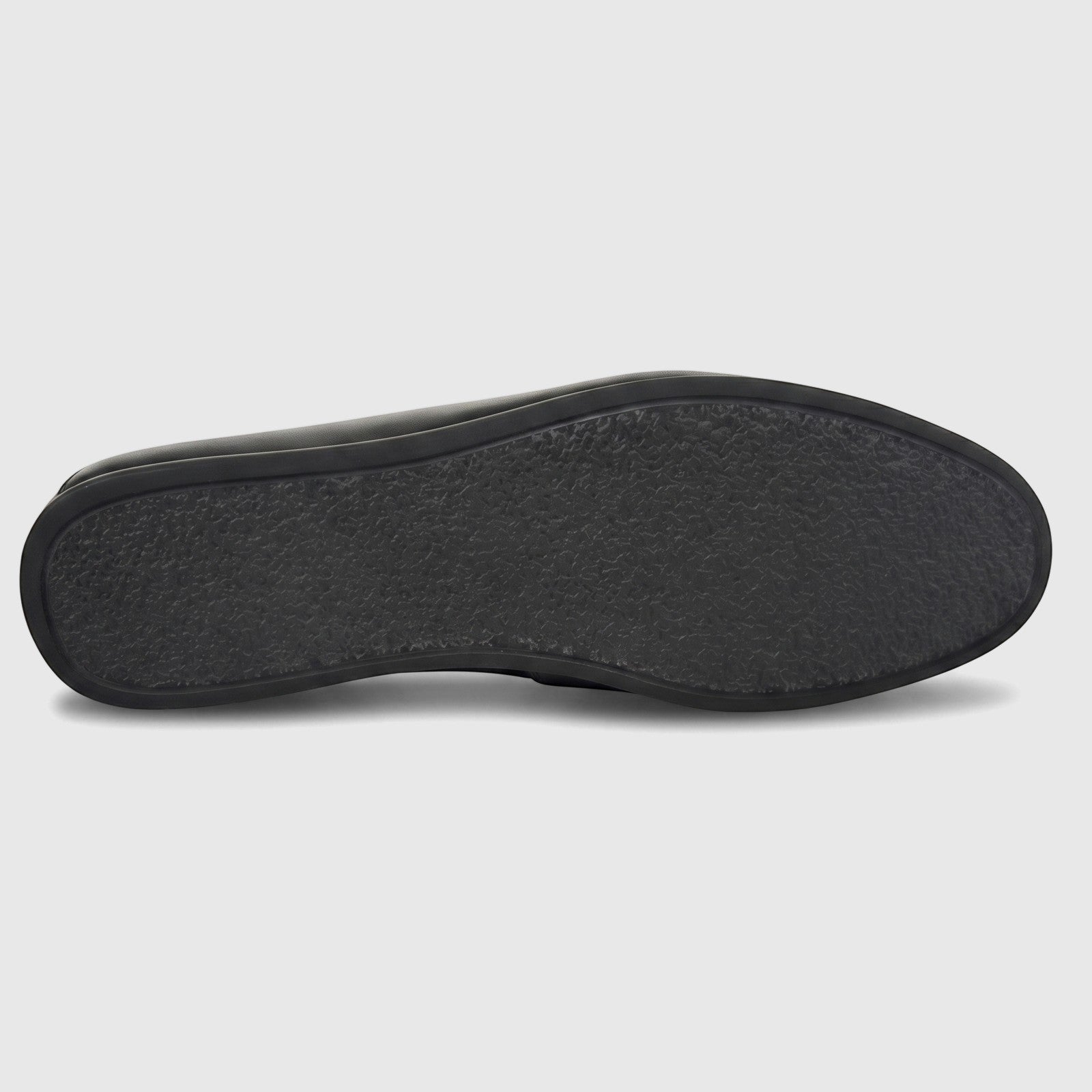 Black Formales Men's Leather Slip On shoe, showing the textured rubber sole and smooth edges against a white background.