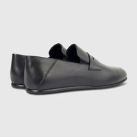 A pair of Formale's men's black leather slip-on shoes, seen from a rear-right quarter view, on a white background.