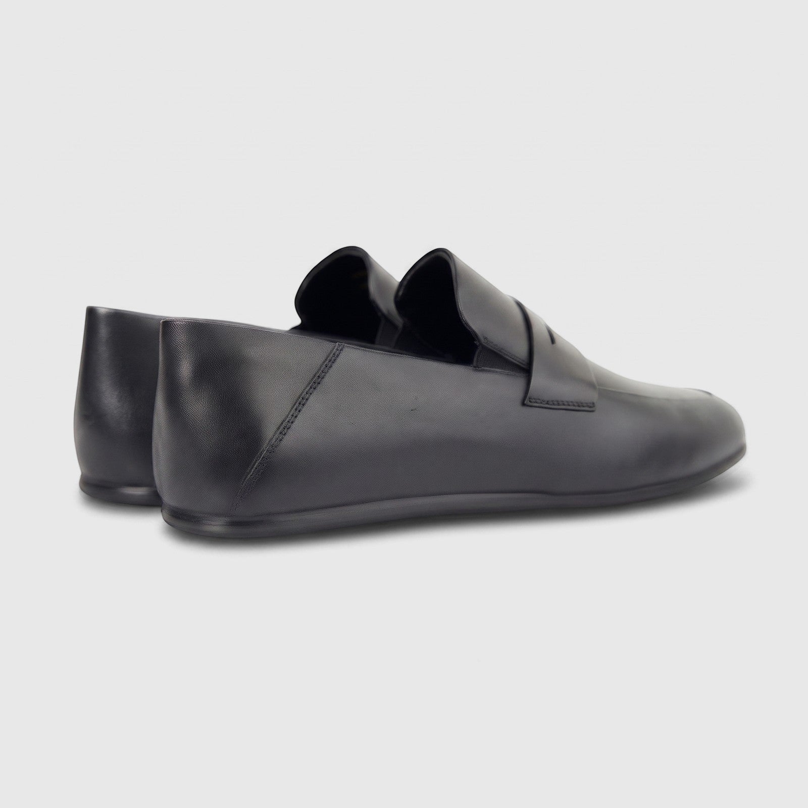 Formales Men's Leather Slip On shoes in black, featuring a sleek design and comfortable fit, shown from a side-rear view.