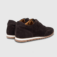 Pair of Formales men's low-top leather sneakers in dark brown suede, viewed from the rear on a white background.