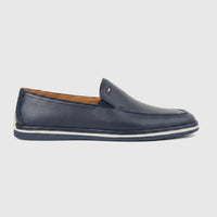 Men's Formales navy blue leather loafer with white sole detailing, featuring a small logo emblem, viewed from the side.