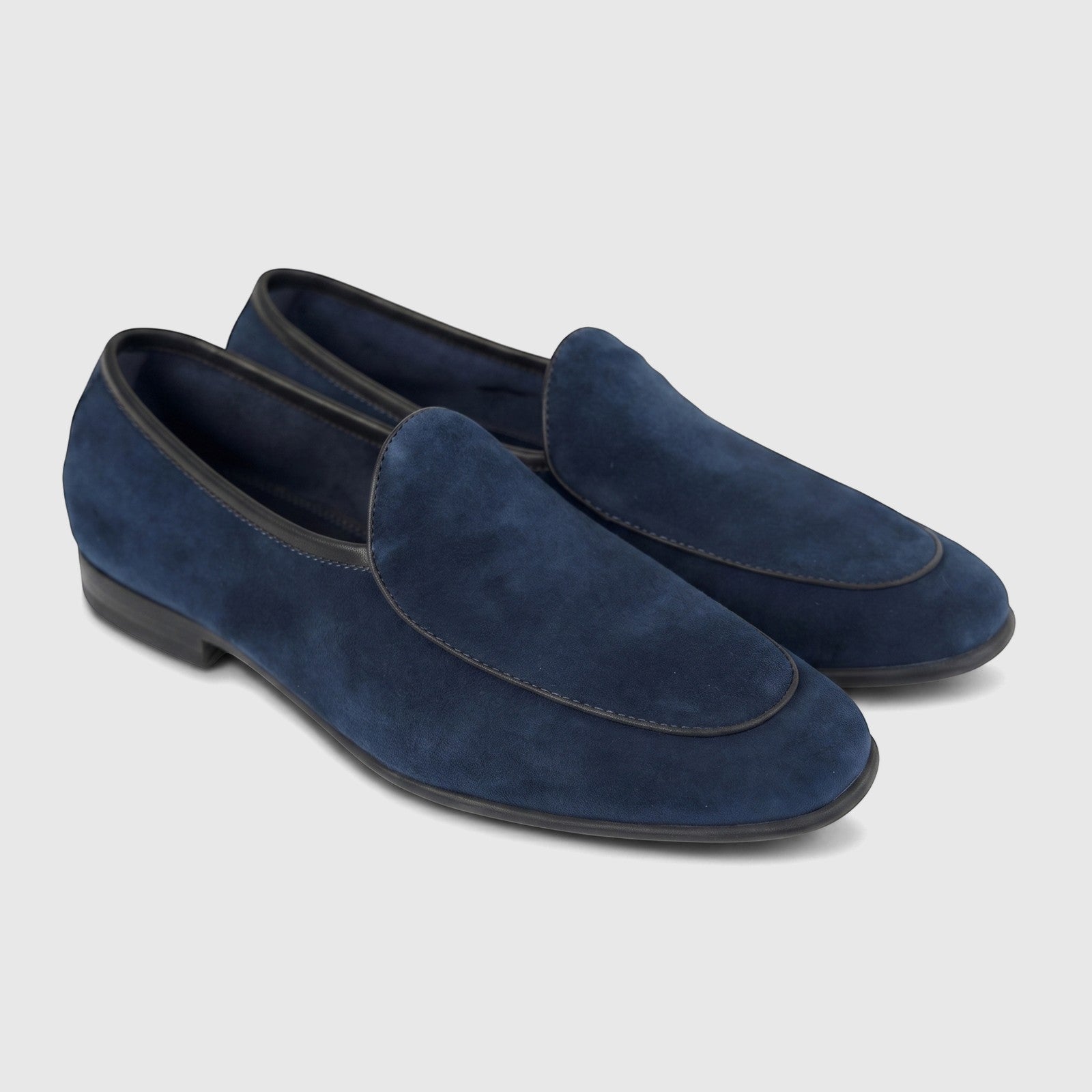 A pair of Formale's men's navy blue suede leather loafers, featuring a classic design with black trim, angled slightly right.