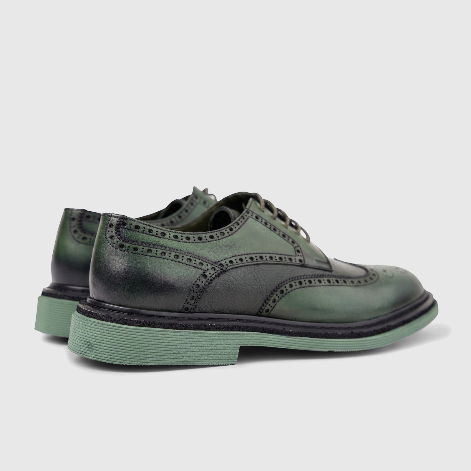 Formales Men's olive green leather chunky sole brogue lace-up shoes, showcasing intricate perforations and a unique sole.