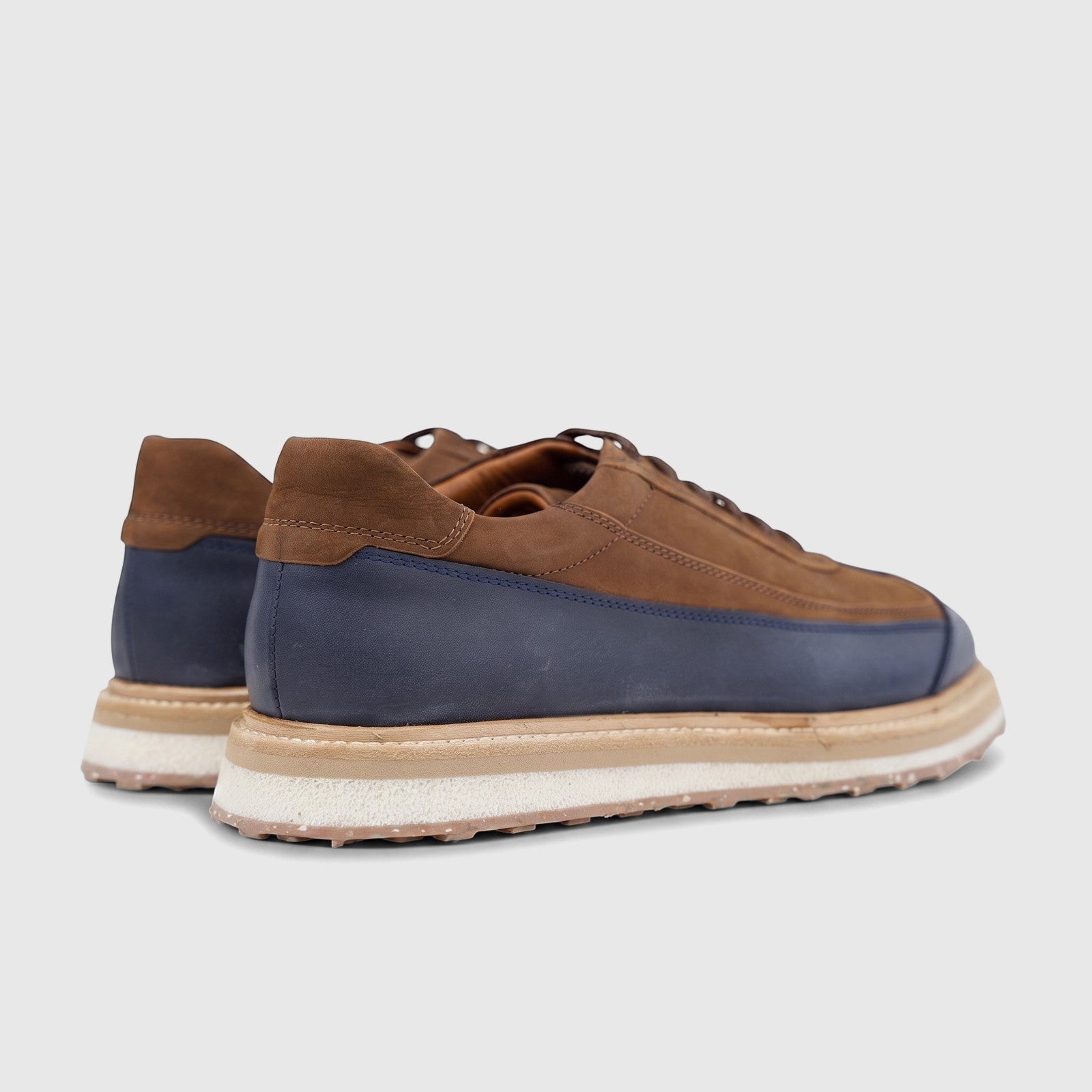 Formales Men's Suede Sneaker 4742 in navy and tan, featuring a layered sole, shown from a rear-side view.