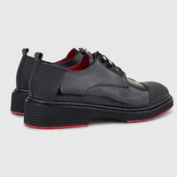 Formales men's black glossy leather lace-up shoes with chunky soles and red accents, viewed from the side-rear.